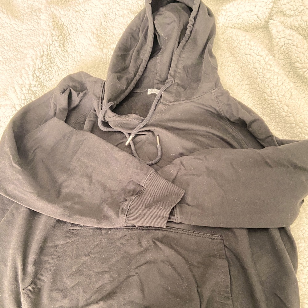 Size M plain black hoodie.
